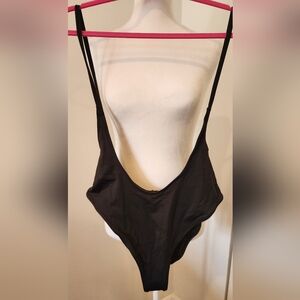 SKIMS Cut Out Open Bust One Piece. NWT. Size Medium.